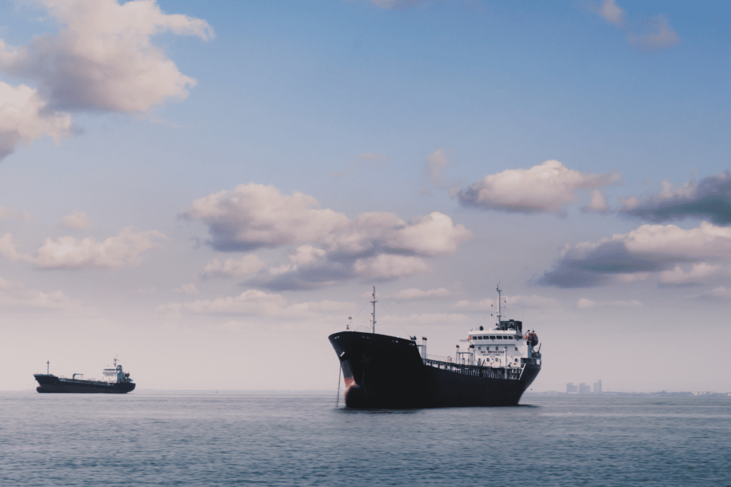 ink boat waiting for space in the port emitting gas emissions