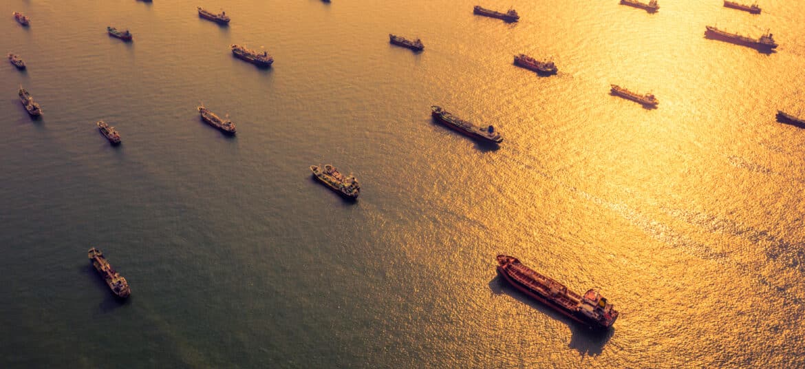 Aerial view of oil and gas ships waiting to berth, port congestion.